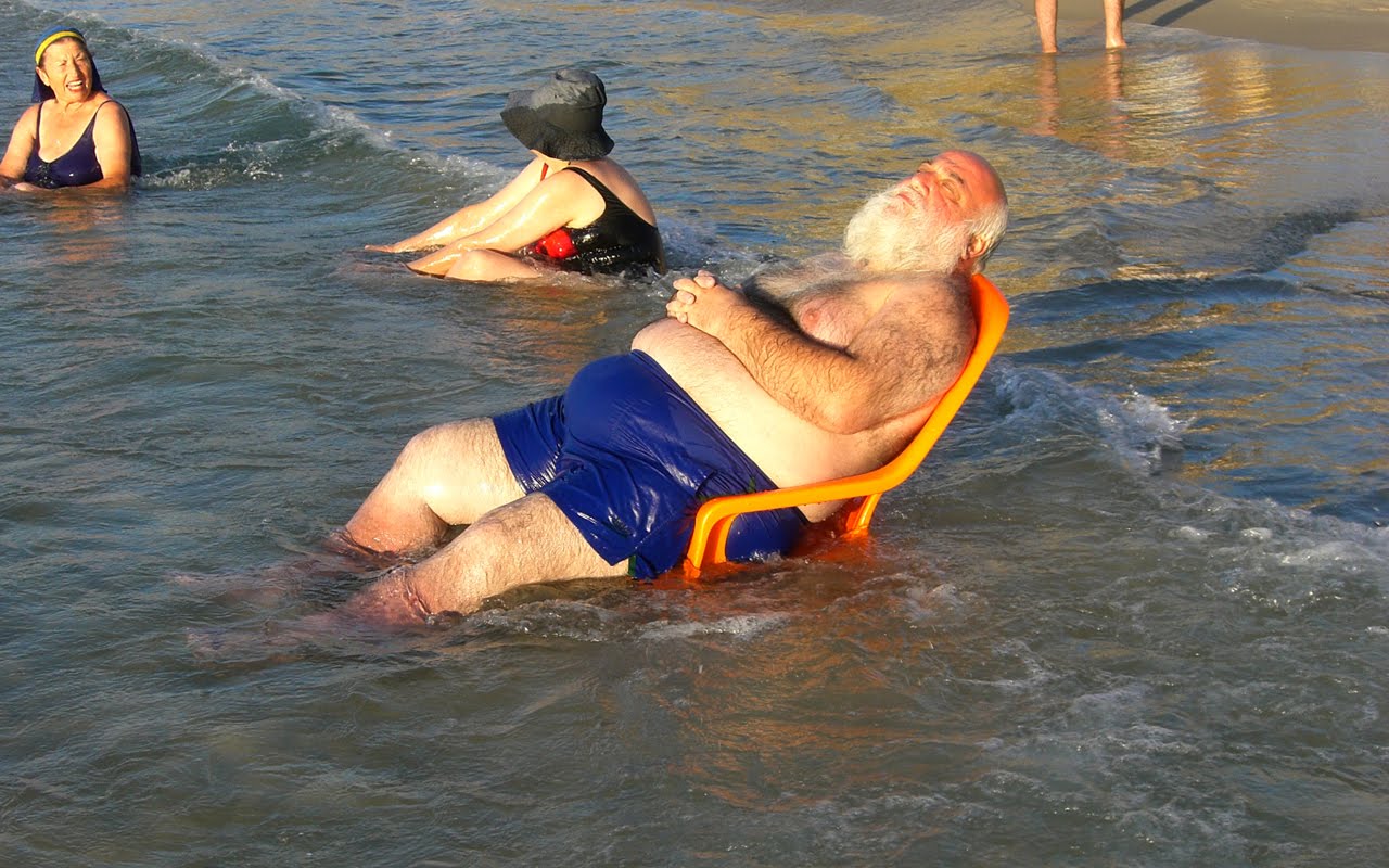 Fat man on beach (1)